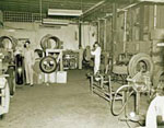 Workers in the local tire shop making tires. Davis Photographic Records, OP 46.414. Photographer/Artist: George C. Davis.